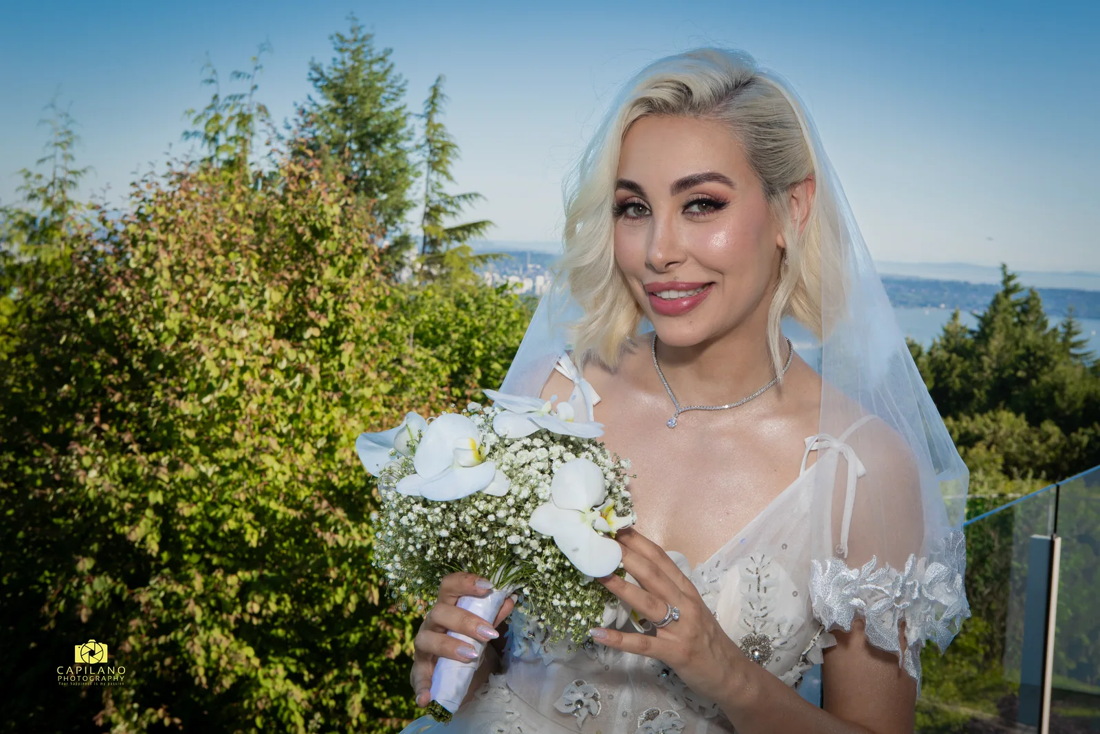 Soft engagement makeup by Makeup by Haleh, bride outdoors holding a white bouquet